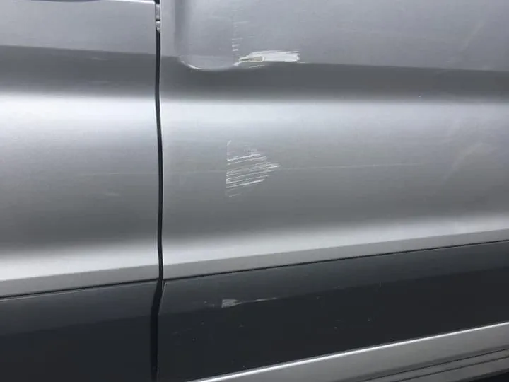 The body of a vehicle that is repaired from a dent